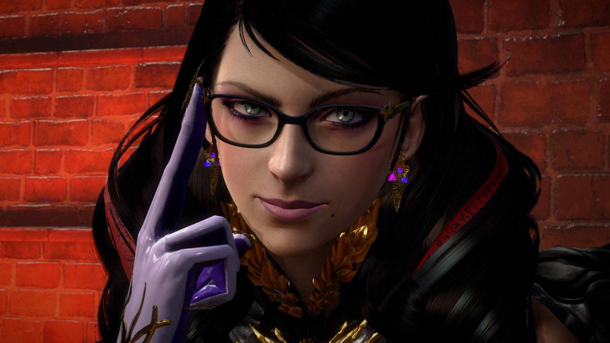 A screenshot from Bayonetta 3 of Bayonetta's face. She is wearing gloves, and one finger is against the right side of her glasses.
