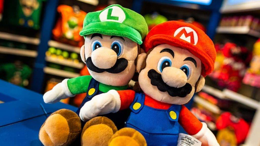 Mario and Luigi plushies in the Super Nintendo World store.