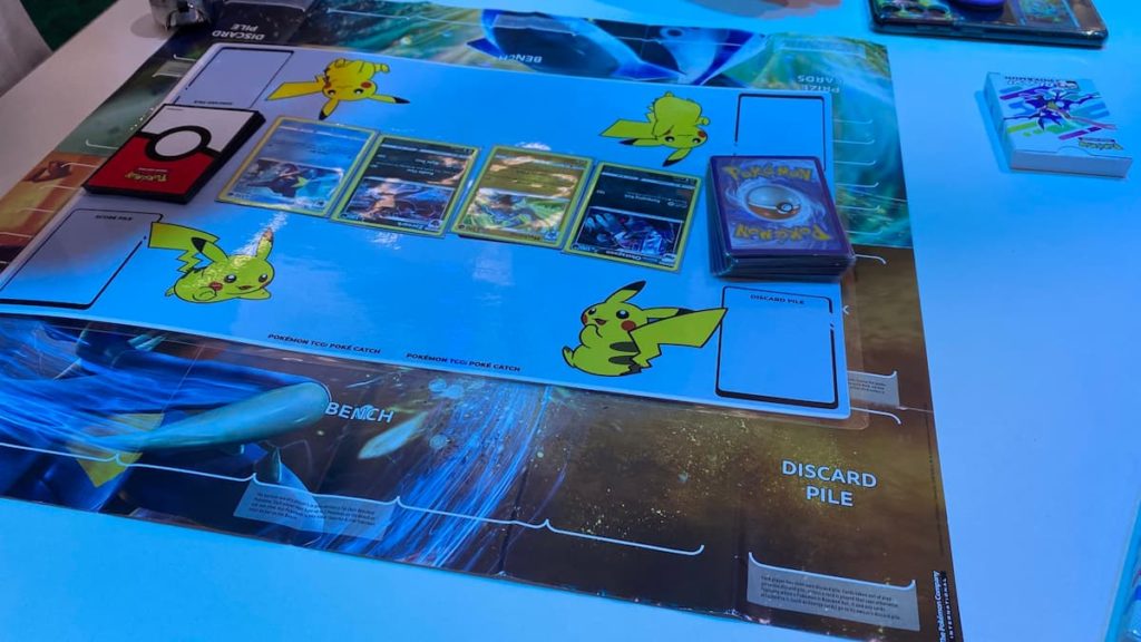 Pokemon Play Lab, Pokémon Trading Card Game photo showing Machamp, Obstagoon, Zoroark, and Sharpedo